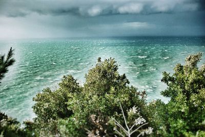 Scenic view of sea against cloudy sky