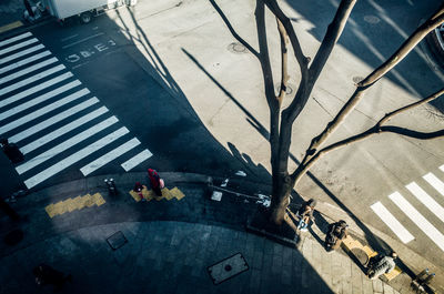 High angle view of people standing on footpath