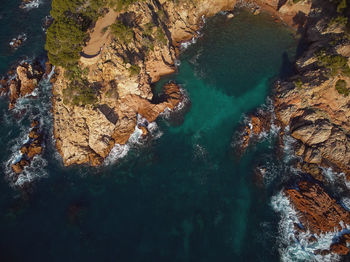 High angle view of rock formation in sea