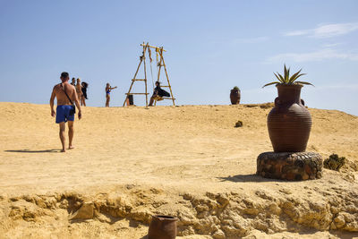 People are relaxing on the beach on sunny day. beach holidays, rest, swimming in the sea.