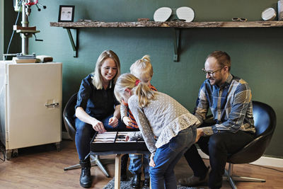 Children with owners in eyeglasses workshop