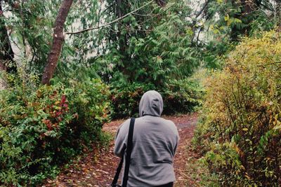 Woman walking in forest