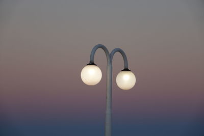 Low angle view of illuminated street light