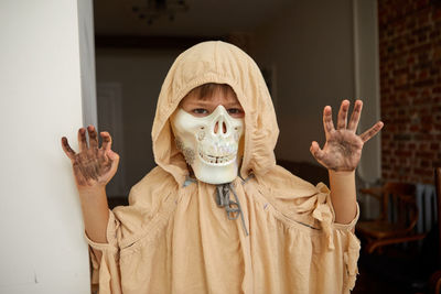 Kid in halloween costume looking at camera