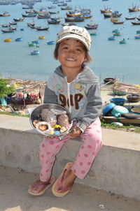 Portrait of smiling girl holding ice cream