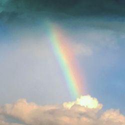 Low angle view of rainbow against sky