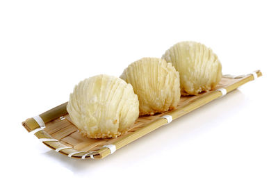 High angle view of food in plate against white background