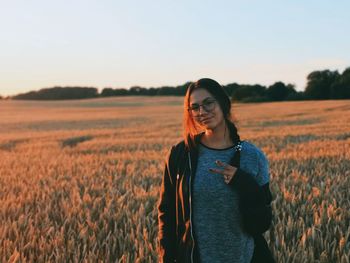 Young woman standing in field