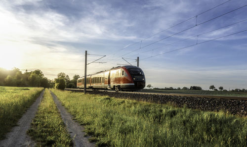 Train on railroad track against sky