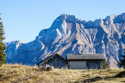 Scenic view of snowcapped mountains against clear sky