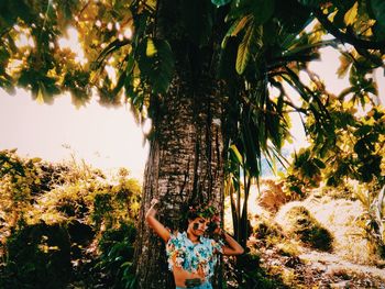 Low angle view of tree against trees