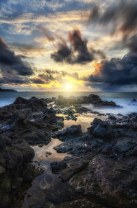 Scenic view of sea against sky during sunset