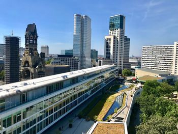 Modern buildings in city against sky