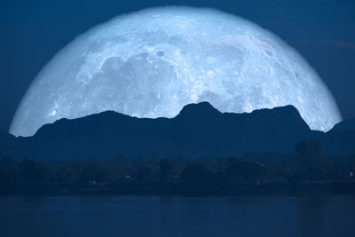 Close-up of sea against sky at night