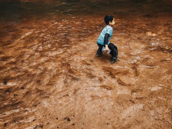 High angle view of boy on beach