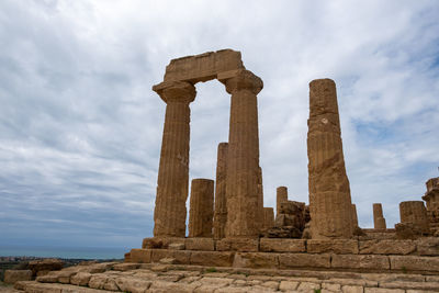 Low angle view of old temple against sky