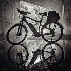 Bicycle parked against wall