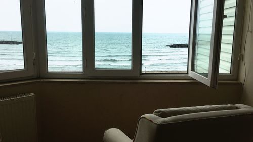 Sea seen through window at home