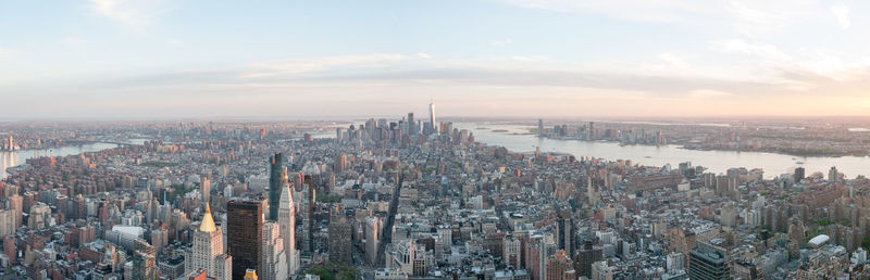 Panoramic shot of modern buildings in city against sky