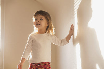 Adorable baby at home at sunset