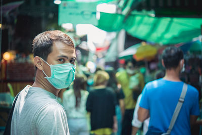 Portrait of man on street in city