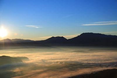 Scenic view of mountains against sky during sunset