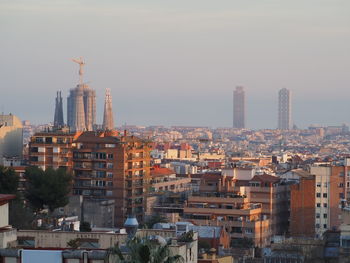 High angle view of buildings in city against sky