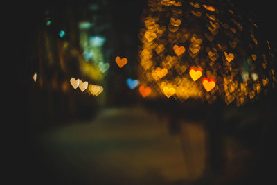 Defocused image of illuminated christmas lights at night