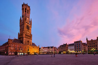 Buildings in city at dusk