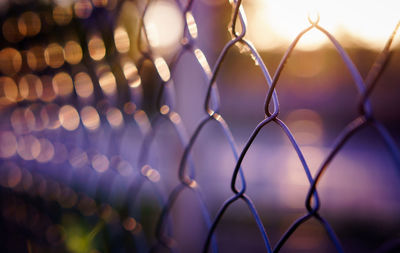 Full frame shot of illuminated lights at fence