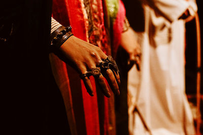 Rear view of person standing on red floor