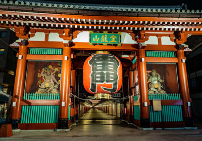 Low angle view of illuminated lanterns outside building