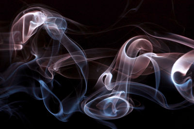 Close-up of smoke against black background