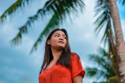 Portrait of a young woman looking up