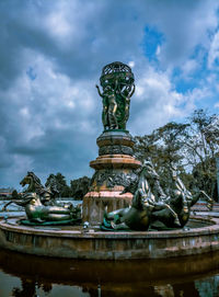 Low angle view of statue against sky