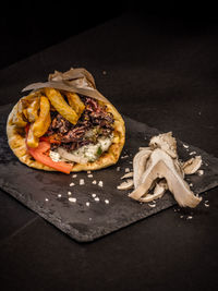 High angle view of bread on table against black background