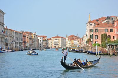 People on boat in canal