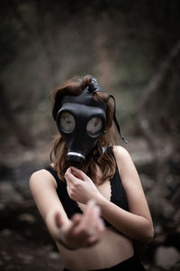 Woman wearing gas mask