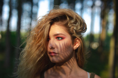 Portrait of young woman in forest