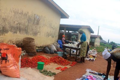 People working at market stall