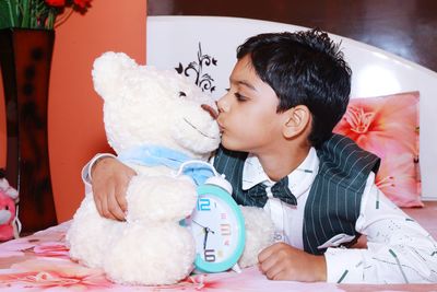 Cute baby boy lying on bed