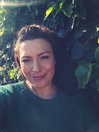 Portrait of a smiling young woman outdoors