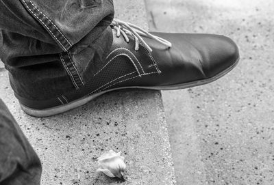 Low section of person wearing shoes