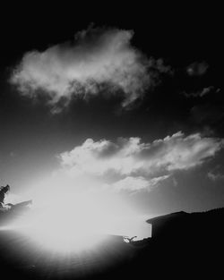 Low angle view of silhouette building against sky