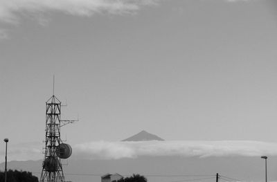 Low angle view of communications tower against sky