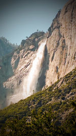 Scenic view of waterfall against clear sky