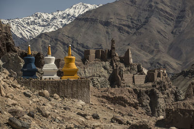 Stupa against mountains during winter
