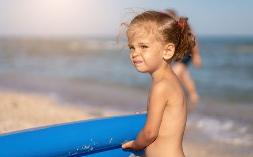 Boy looking at sea shore