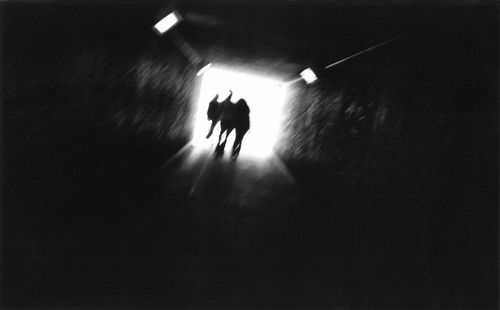 People walking in tunnel