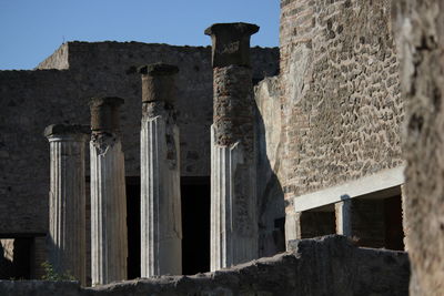 Low angle view of old ruin building against sky